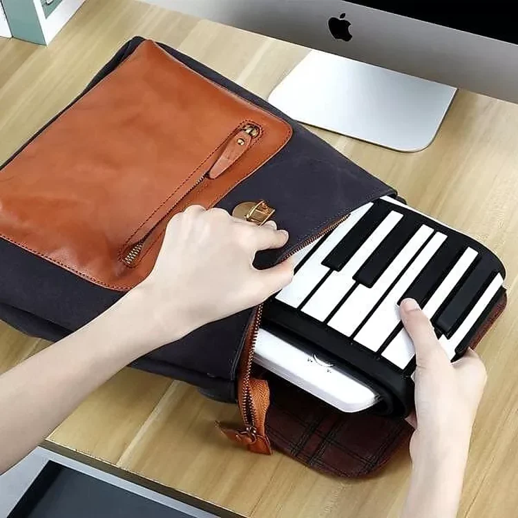 TILLFÄLLIGT 50% RABATT | RollTune™ | Bärbart handrullspiano - Image 2